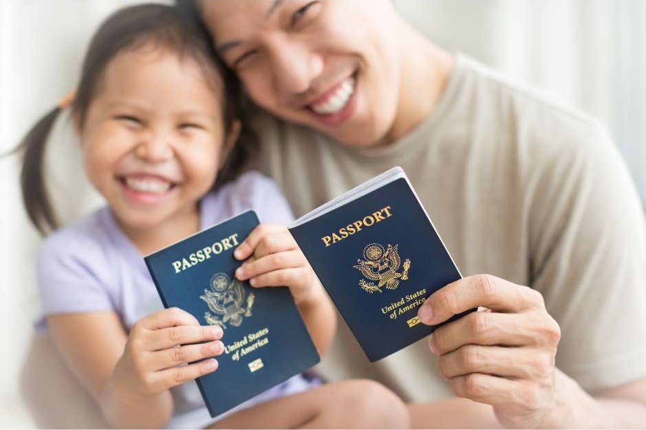 parent holding child passport at passport office